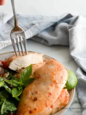 chicken cutlet with Italian Marinade served on fork.
