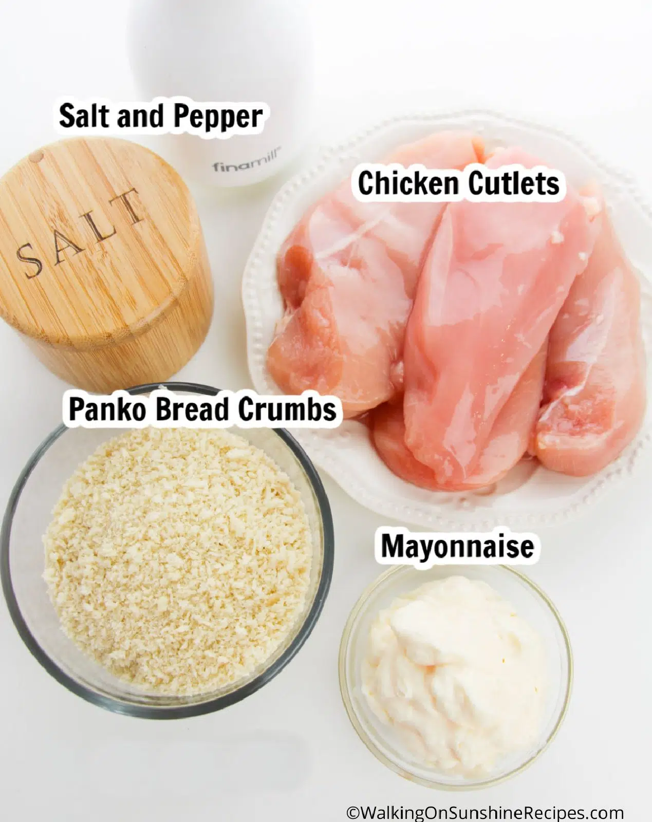 Ingredients for chicken cutlets spread with mayonnaise and panko breadcrumbs.