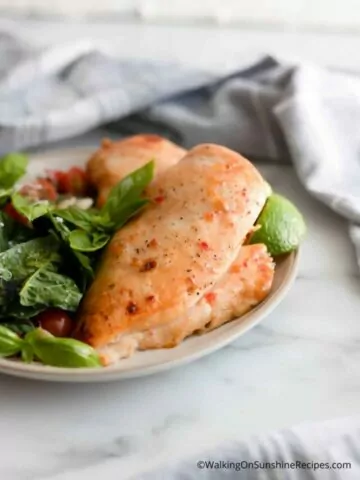 baked chciken cutlets served with side spinach salad.