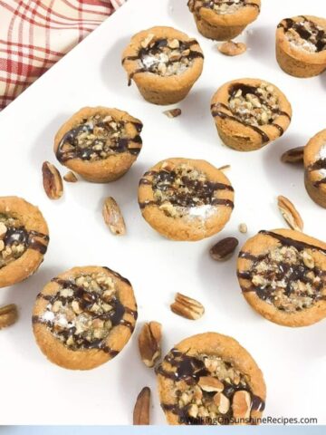 Pecan Pie Cookie Tarts on white plate.