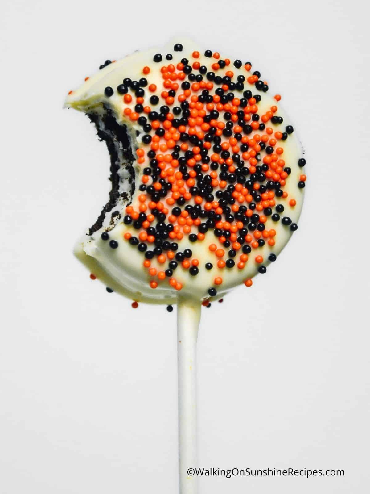 Oreo Halloween Cookies on a stick with bite.