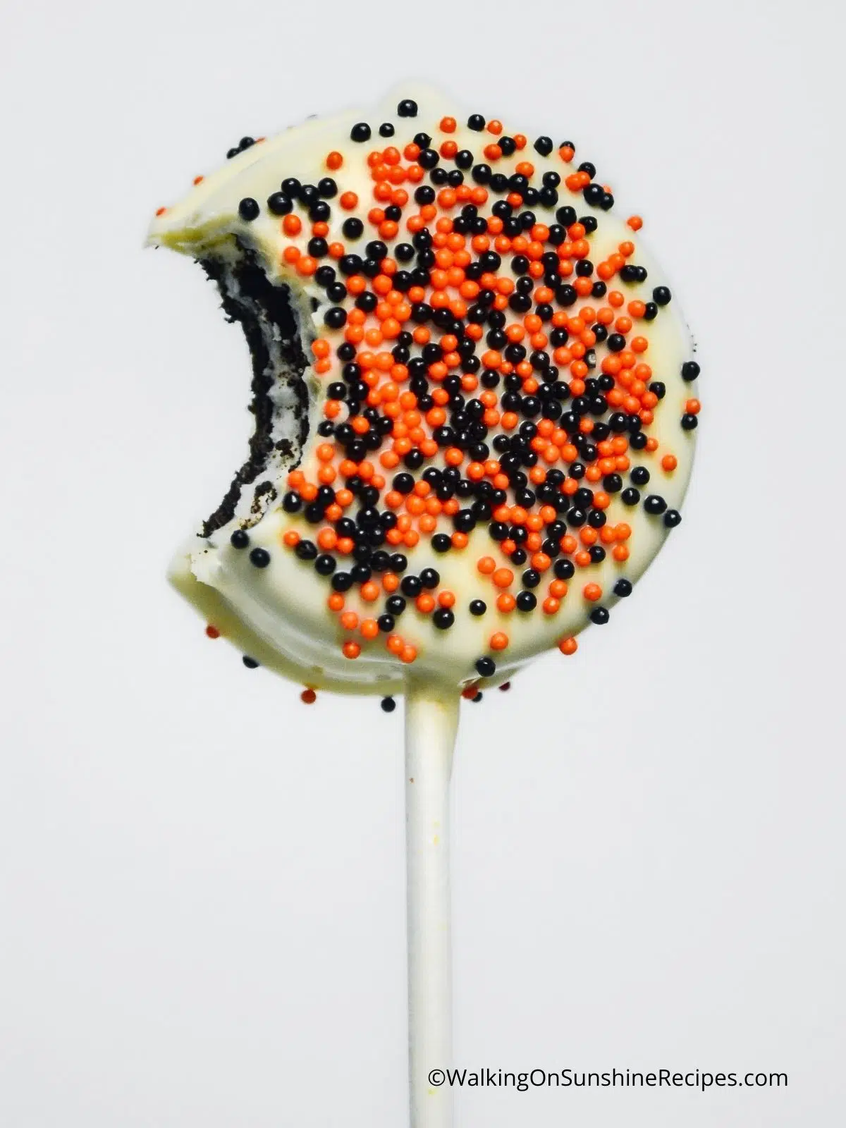 Oreo Halloween Cookies on a stick with bite.
