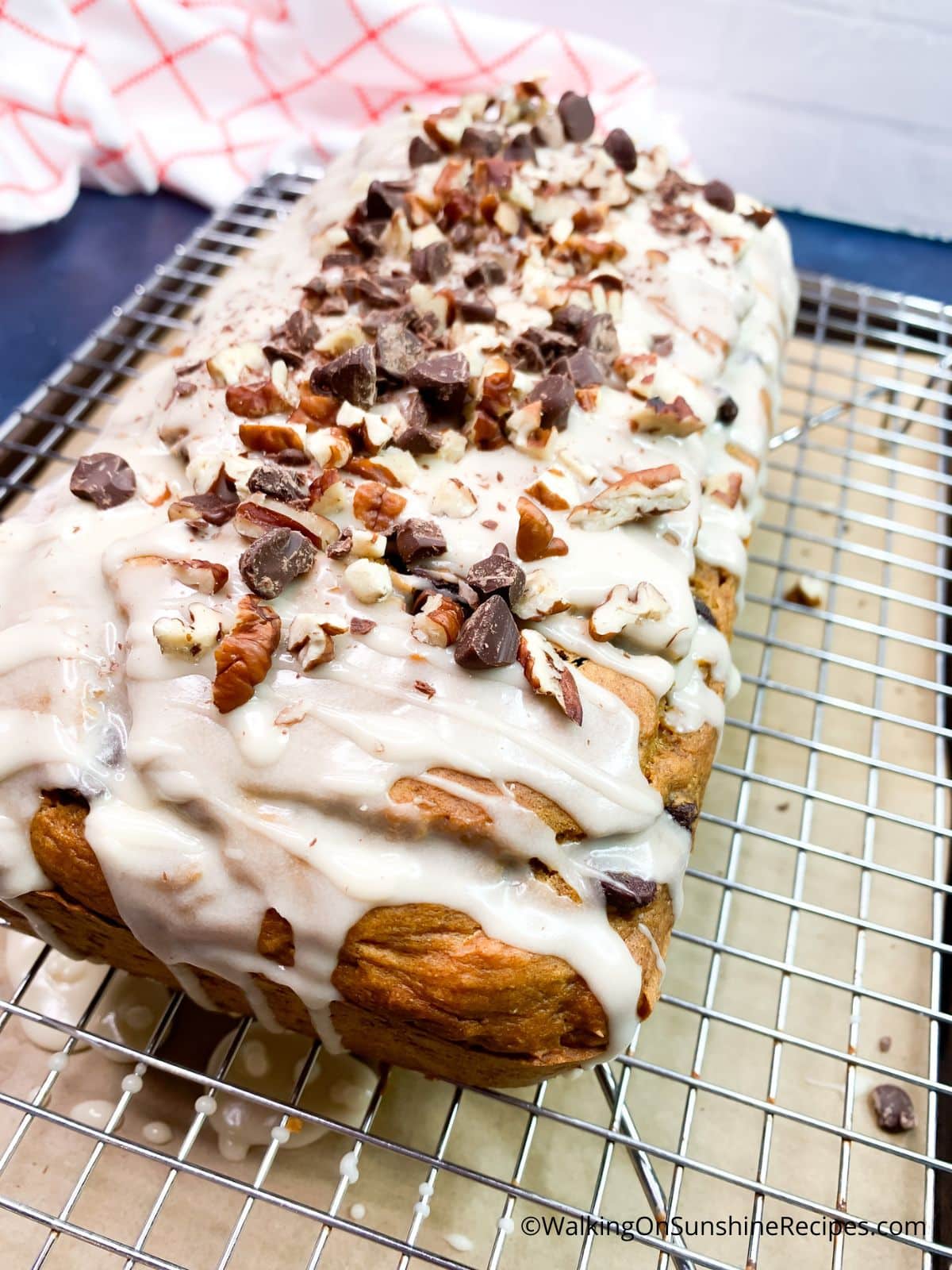 Top pumpkin bread with chopped walnuts and chocolate chips.