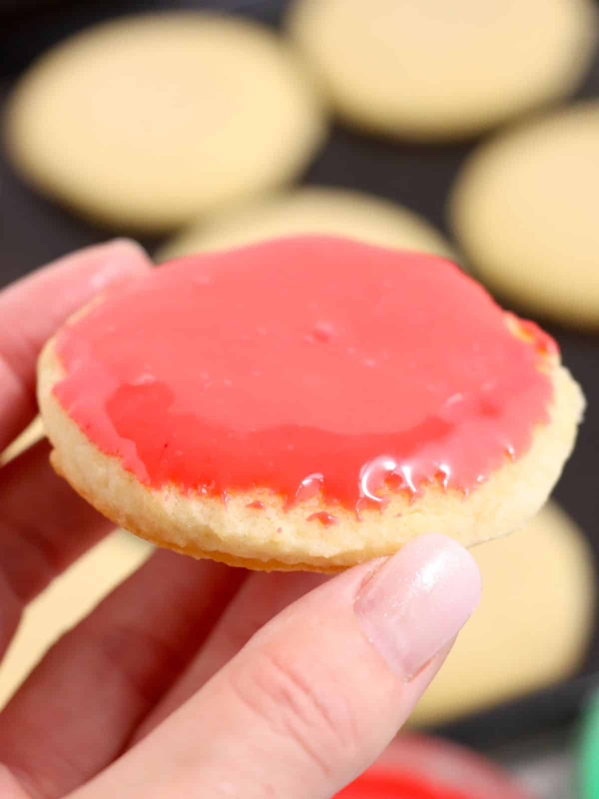 sugar cookie with red colored frosting.