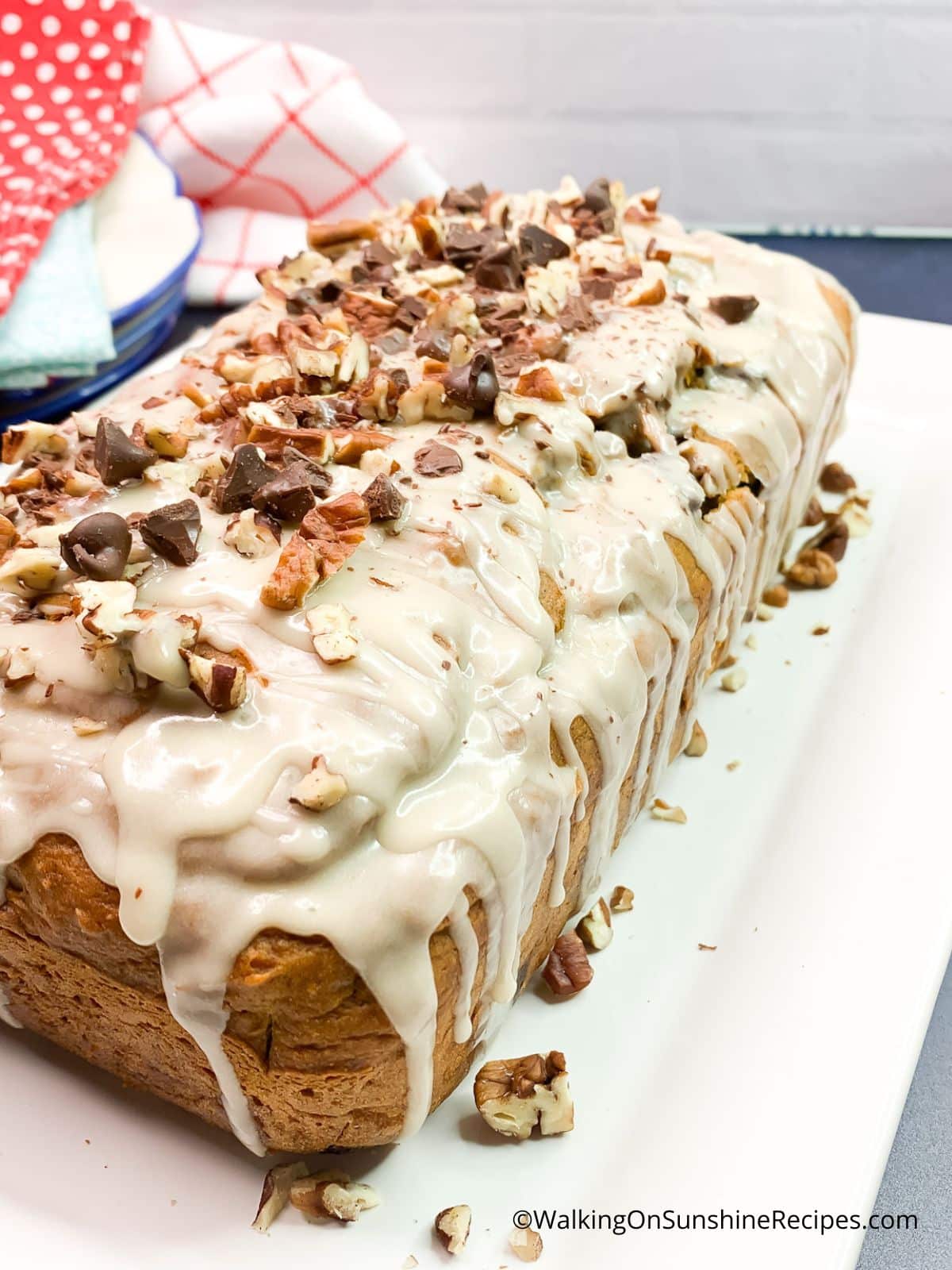 Cake Mix Pumpkin Bread with chopped pecans, chocolate chips and maple sugar glaze.