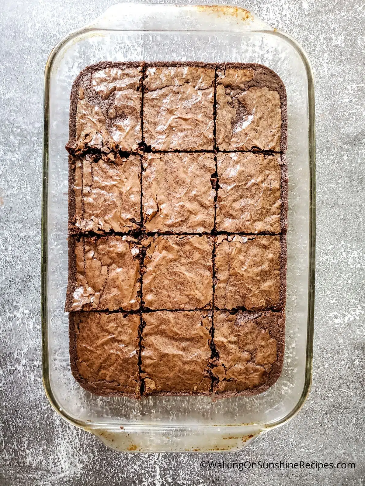 baked brownies in baking dish cut.