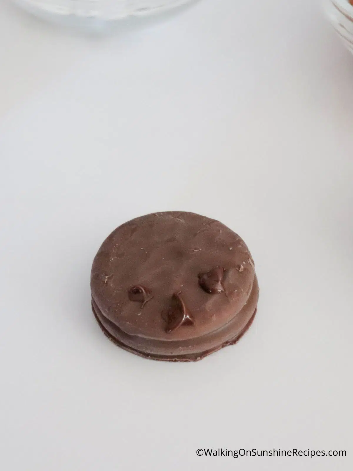 Add melted chocolate to adhere candy eyes and nose for reindeer.