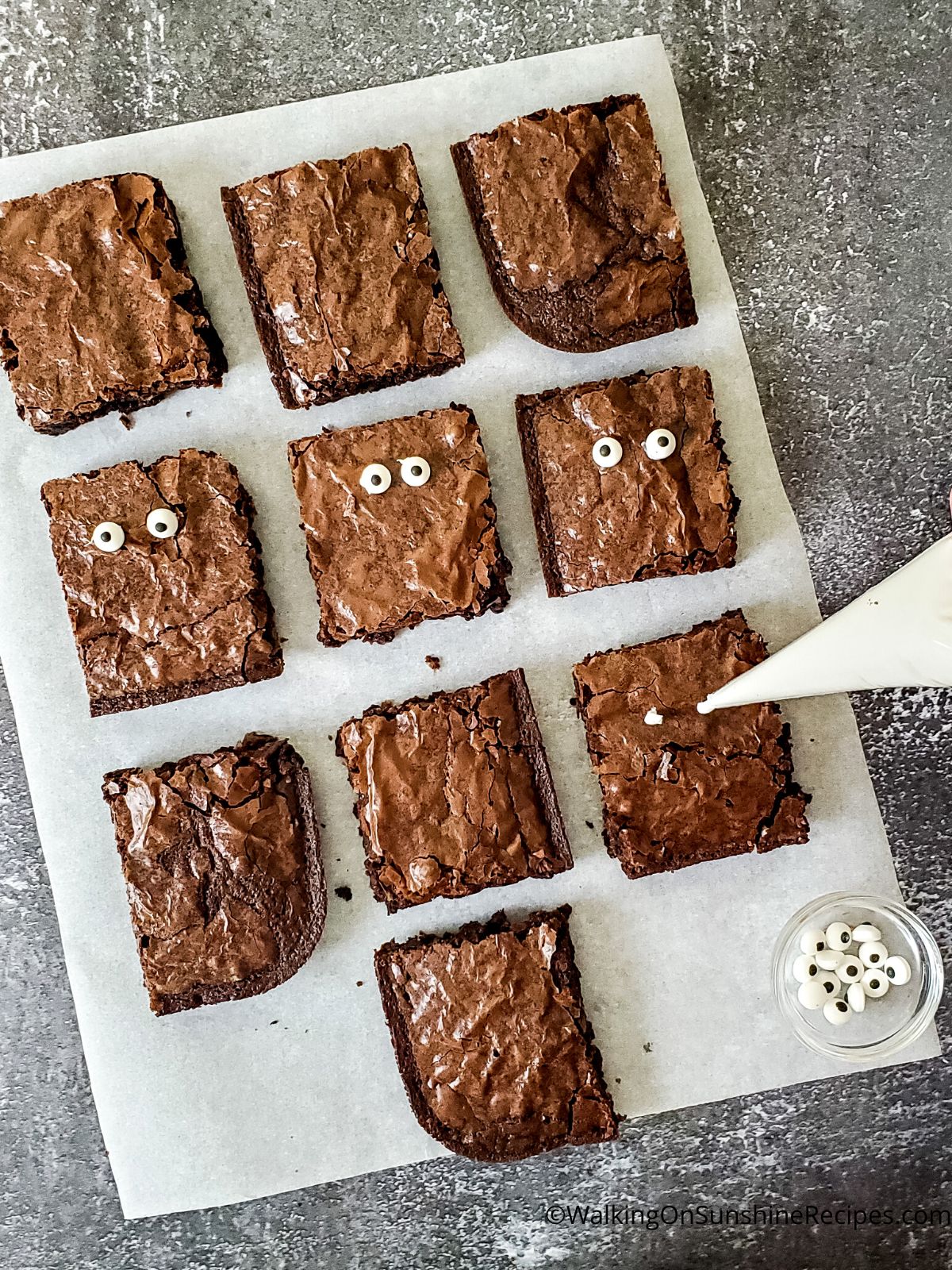 Add vanilla frosting to brownies.