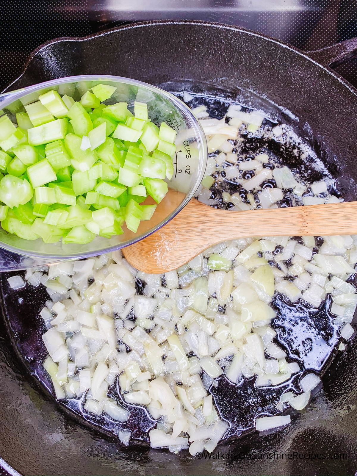 Add celery to cast iron skillet with onion.