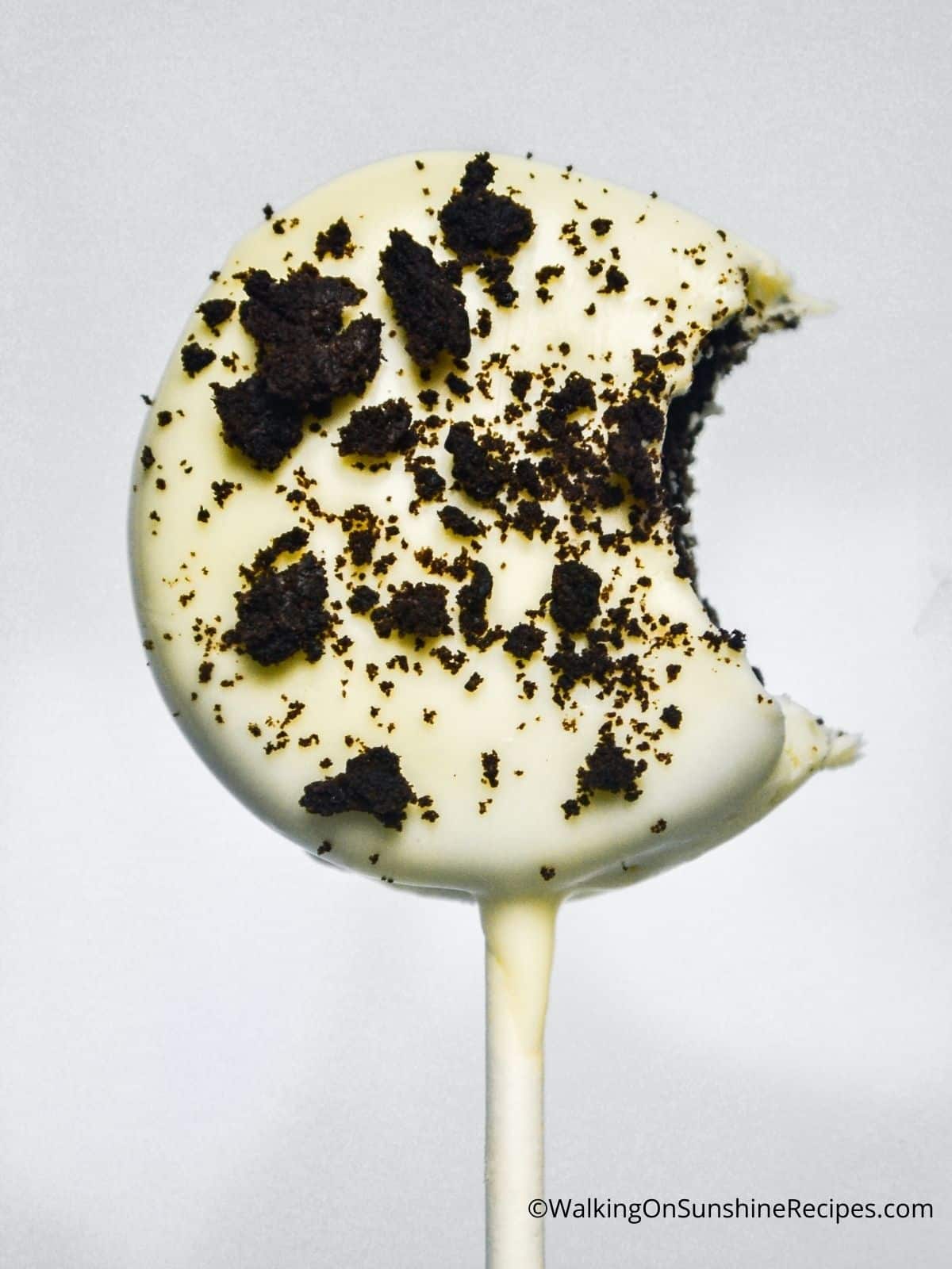Chocolate covered Oreo with cookie crumbs.