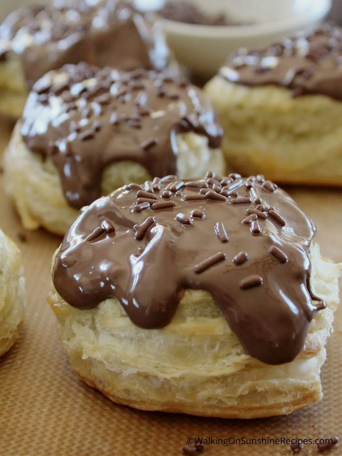 Puff Pastry Circles with melted chocolate and sprinkles.