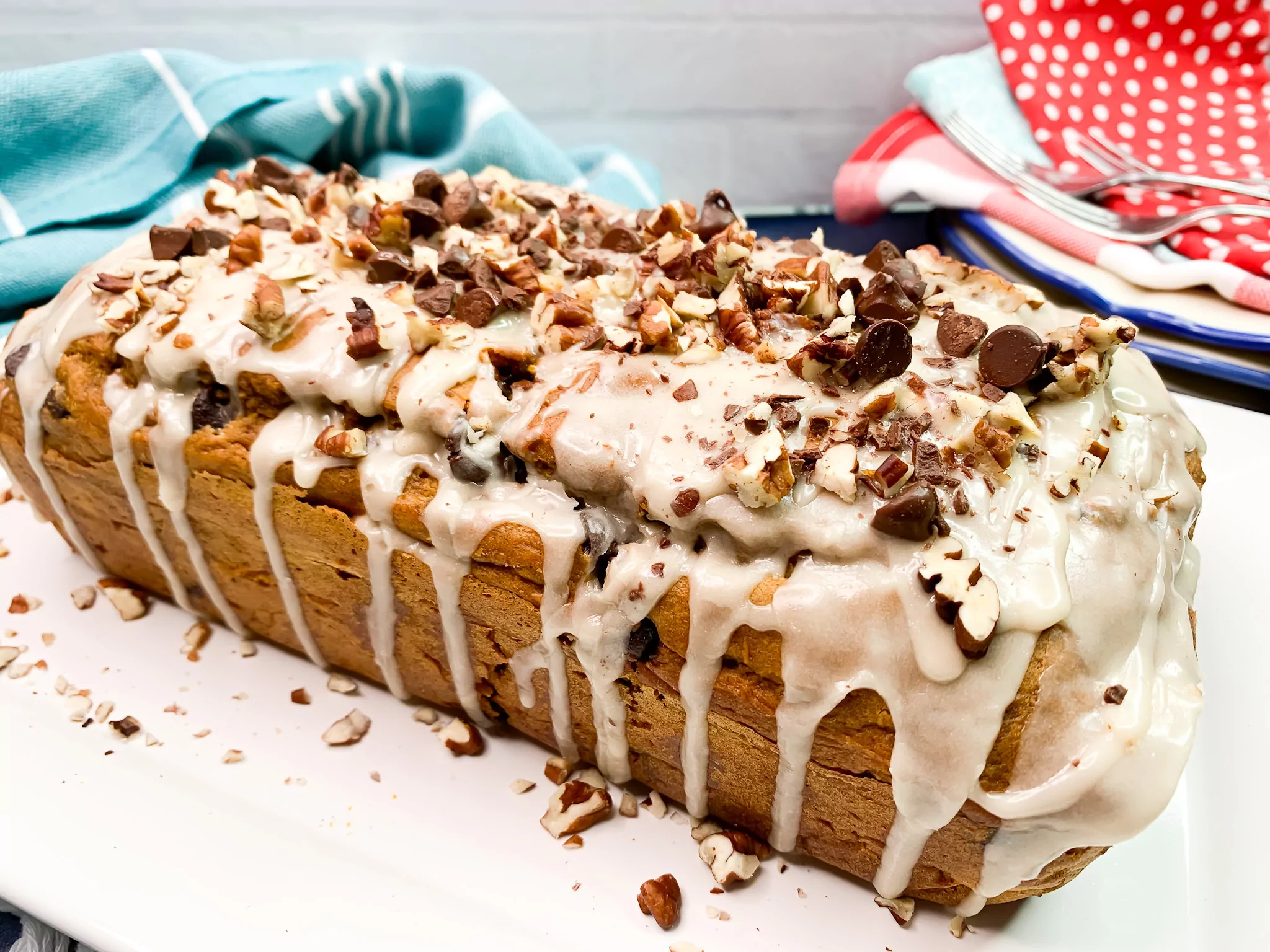 loaf of Cake Mix Pumpkin Bread with maple glaze, chopped nuts and chocolate chips