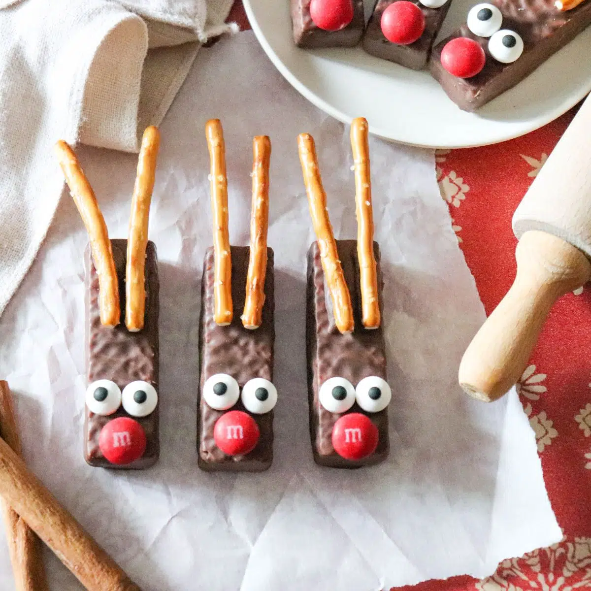 chocolate covered cookies with candy eyes and pretzel antlers.