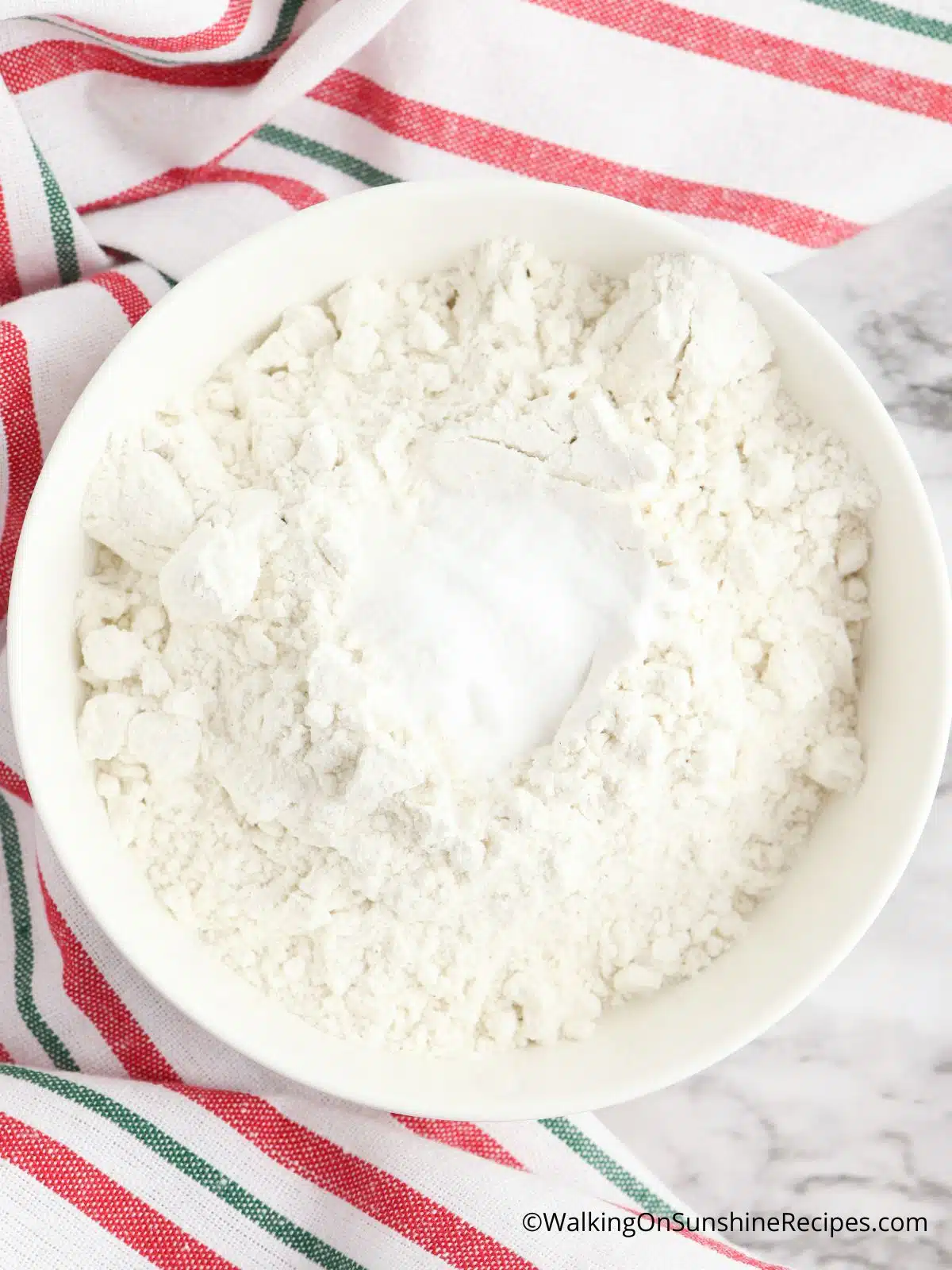 Combine flour with baking soda and salt.