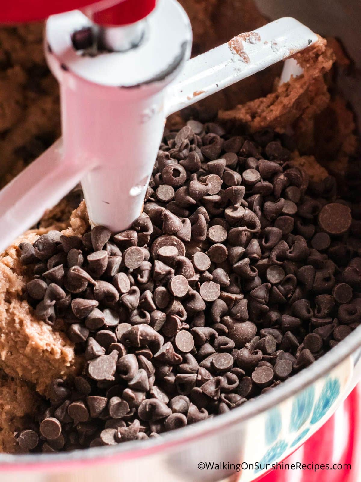 Add chocolate chips to cookie batter.