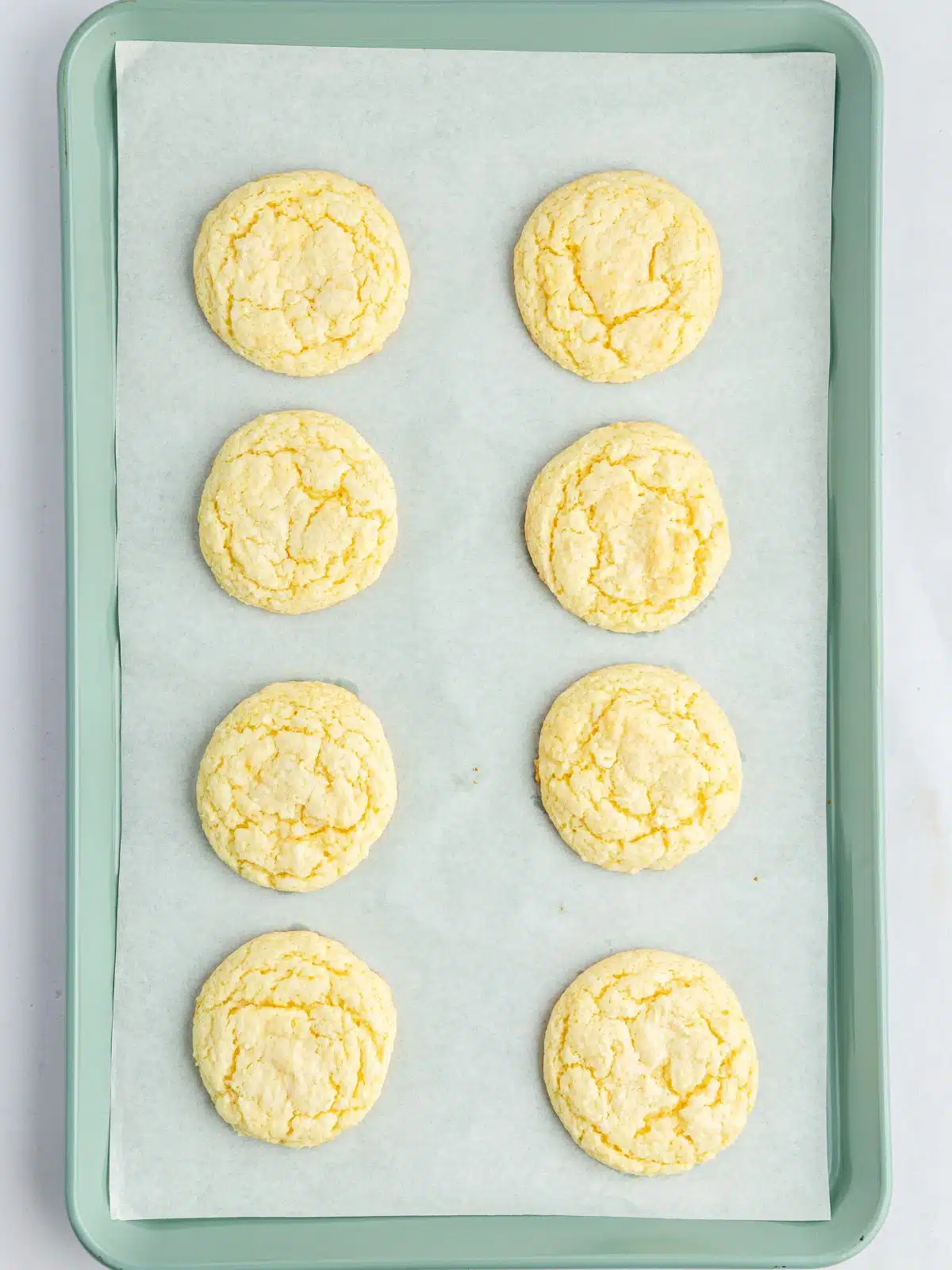 baked cake mix cookies on tray.
