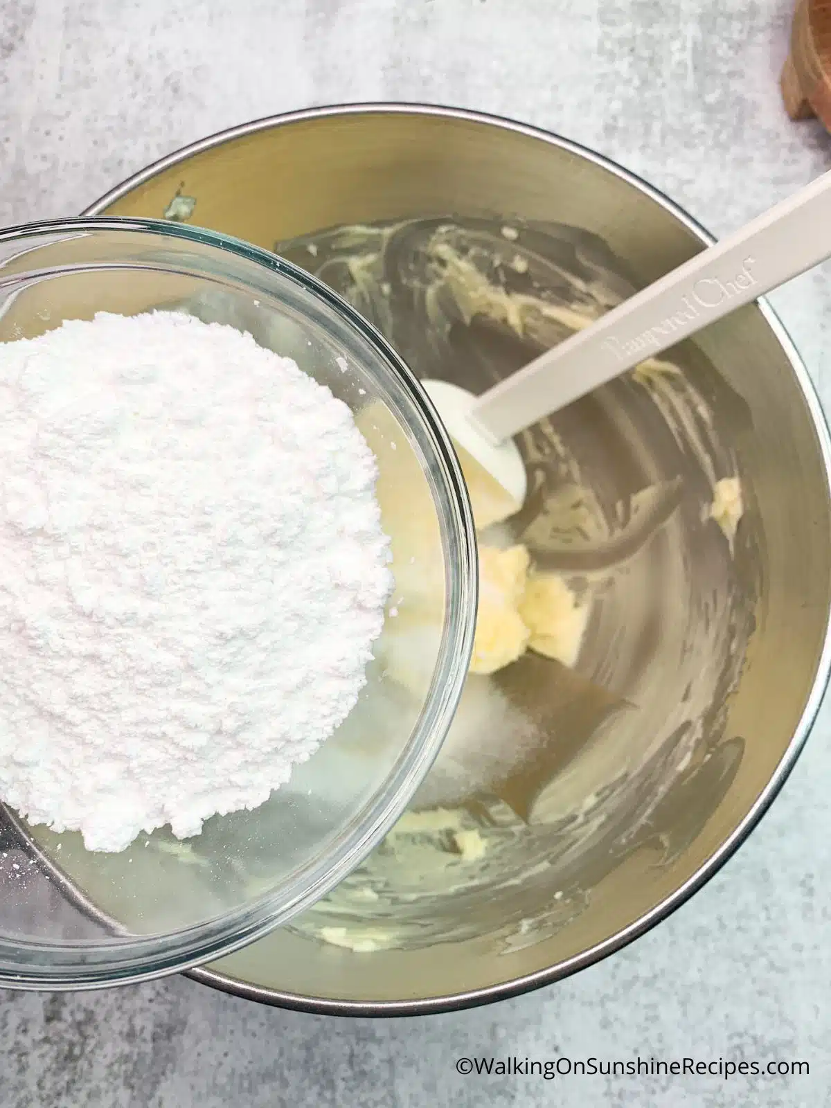 Add powdered sugar to butter.