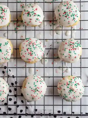 Italian sprinkle cookies with ricotta on baking tray.