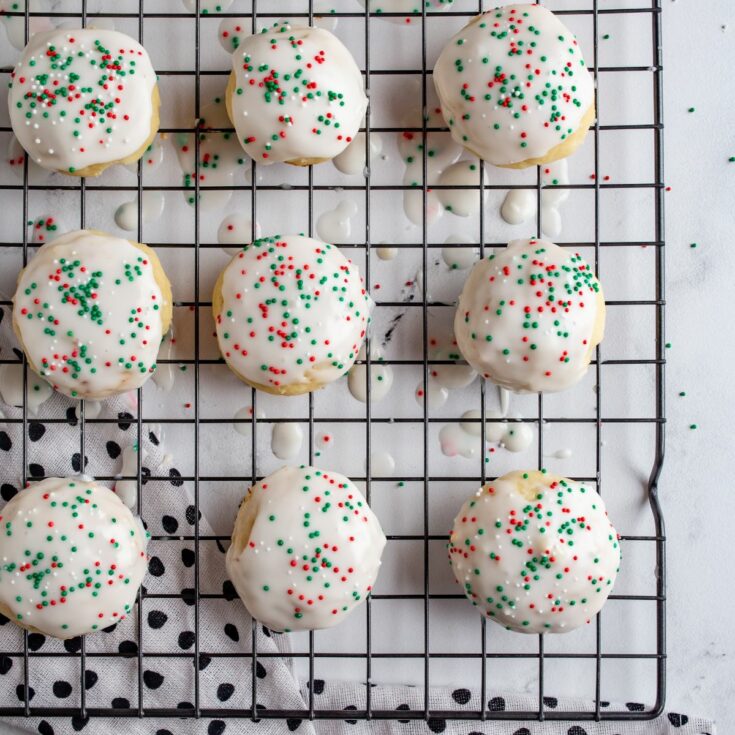 Italian sprinkle cookies with ricotta on baking tray.