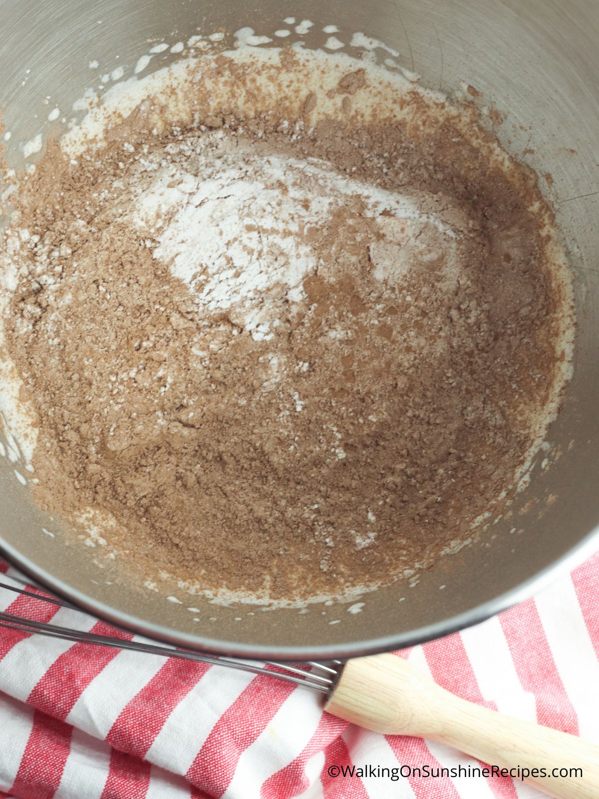 cocoa powder and whipping cream in bowl.