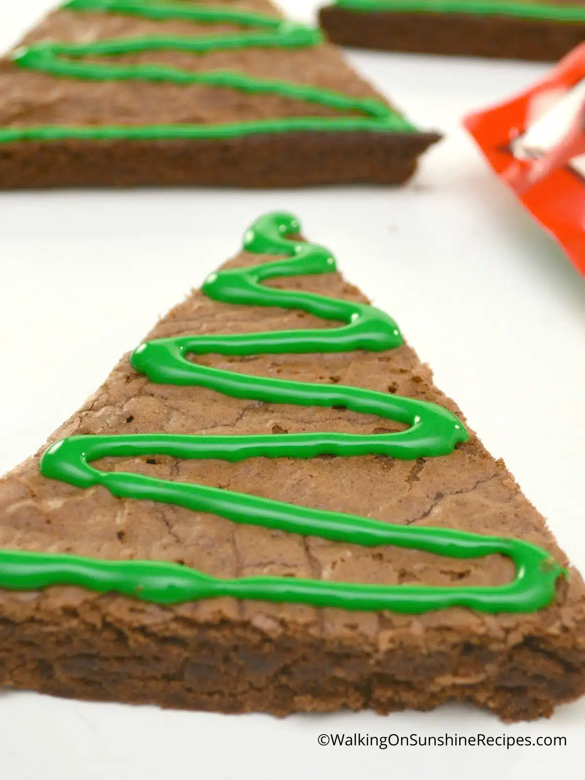 Green frosting on Christmas tree brownie.