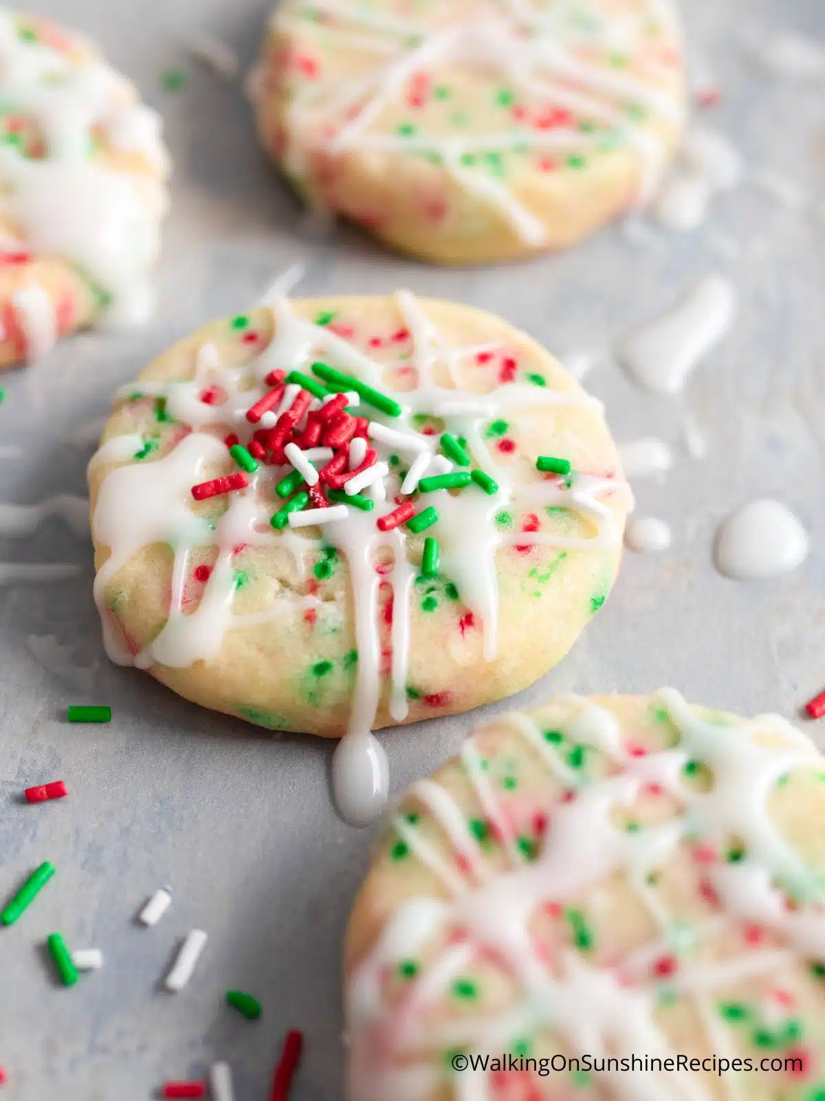 Christmas sprinkles on top of glazed icebox cookies.