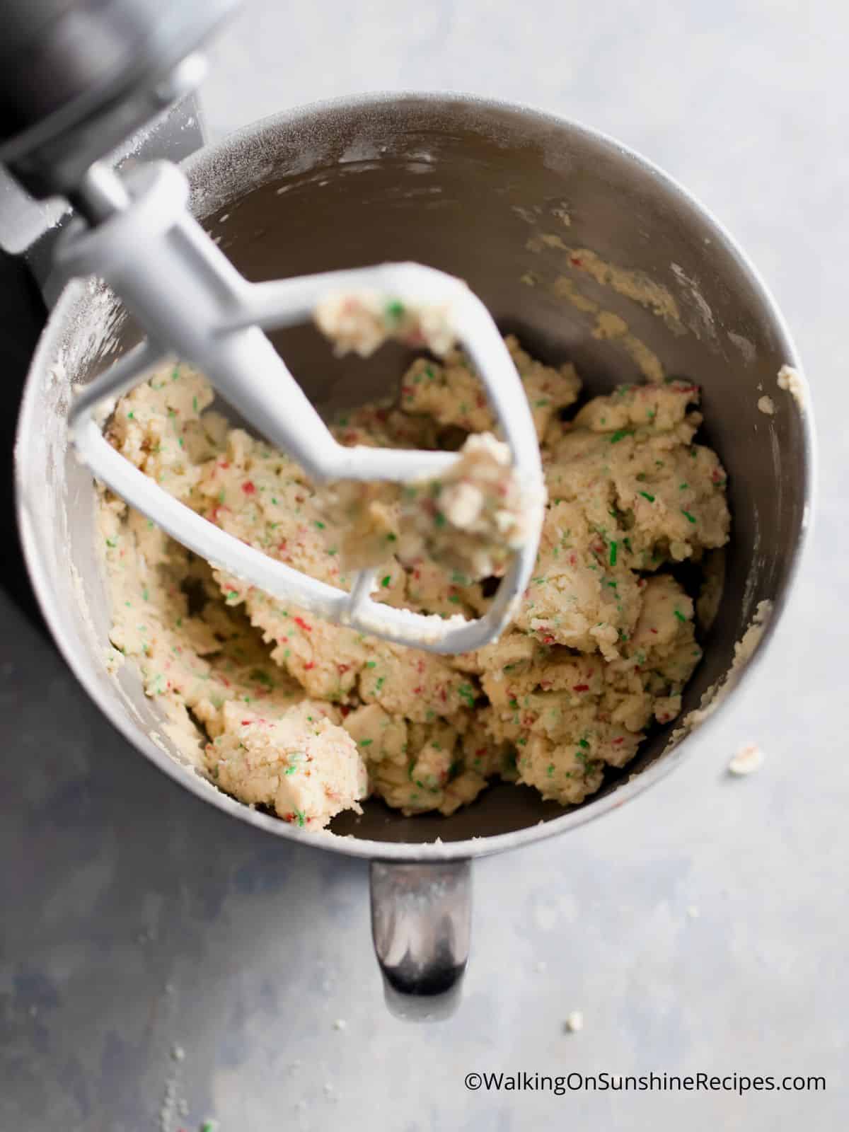 Christmas cookie mixture combined in mixing bowl.