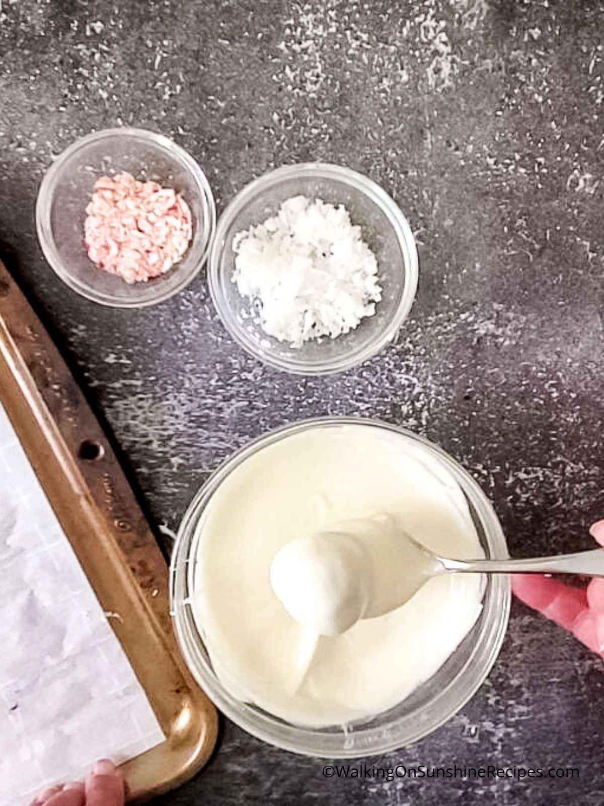 Dip cookie balls in melted white chocolate.