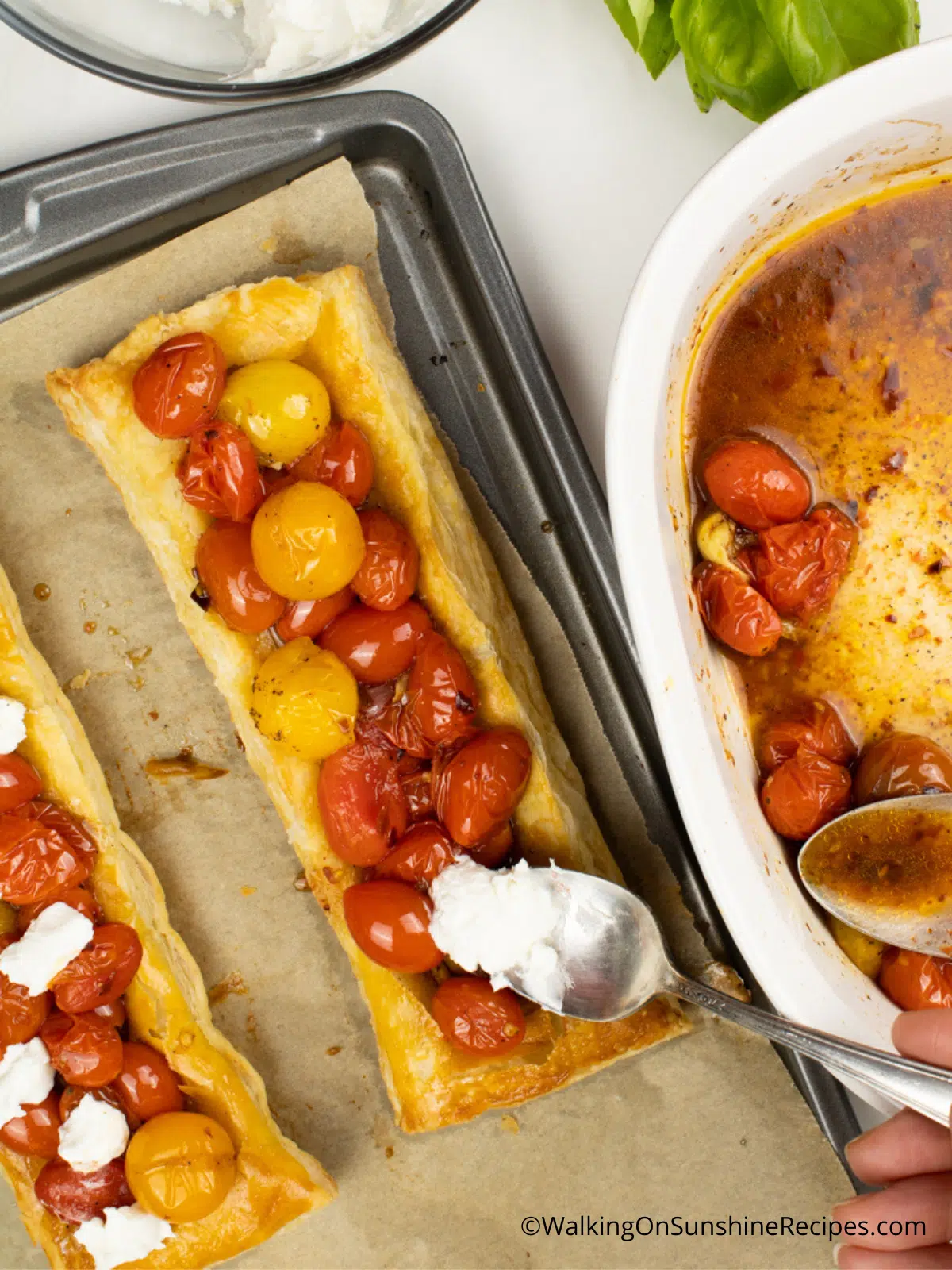 Add cheese to the tops of tomatoes and puff pastry.