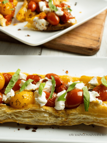 closeup of tomato and puff pastry appetizer.