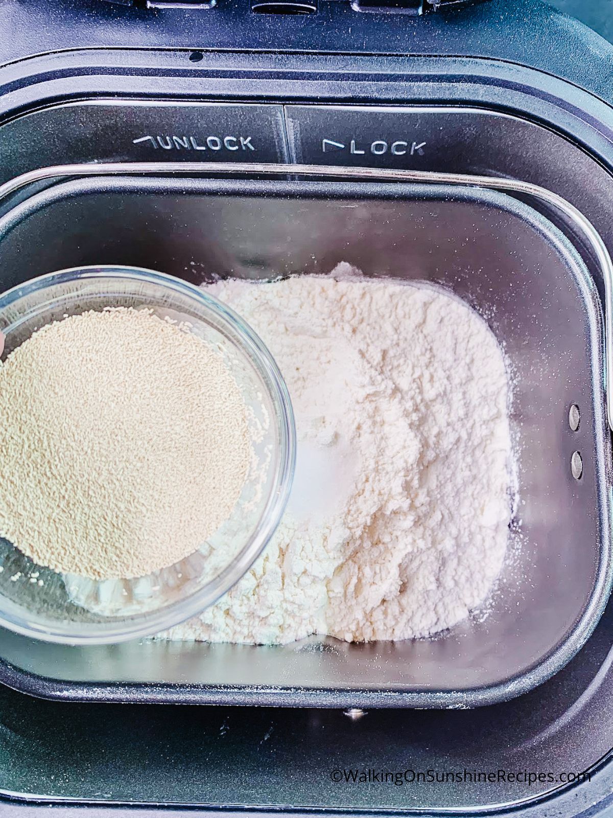 Add yeast to bread machine.