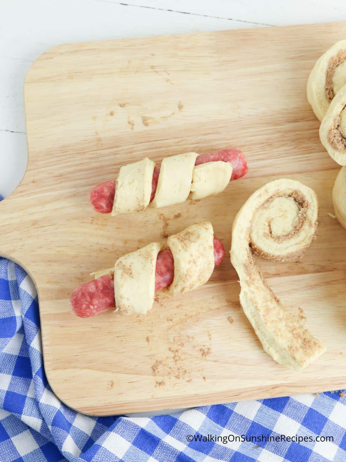wrap cinnamon roll around breakfast sausage links for easy breakfast idea.