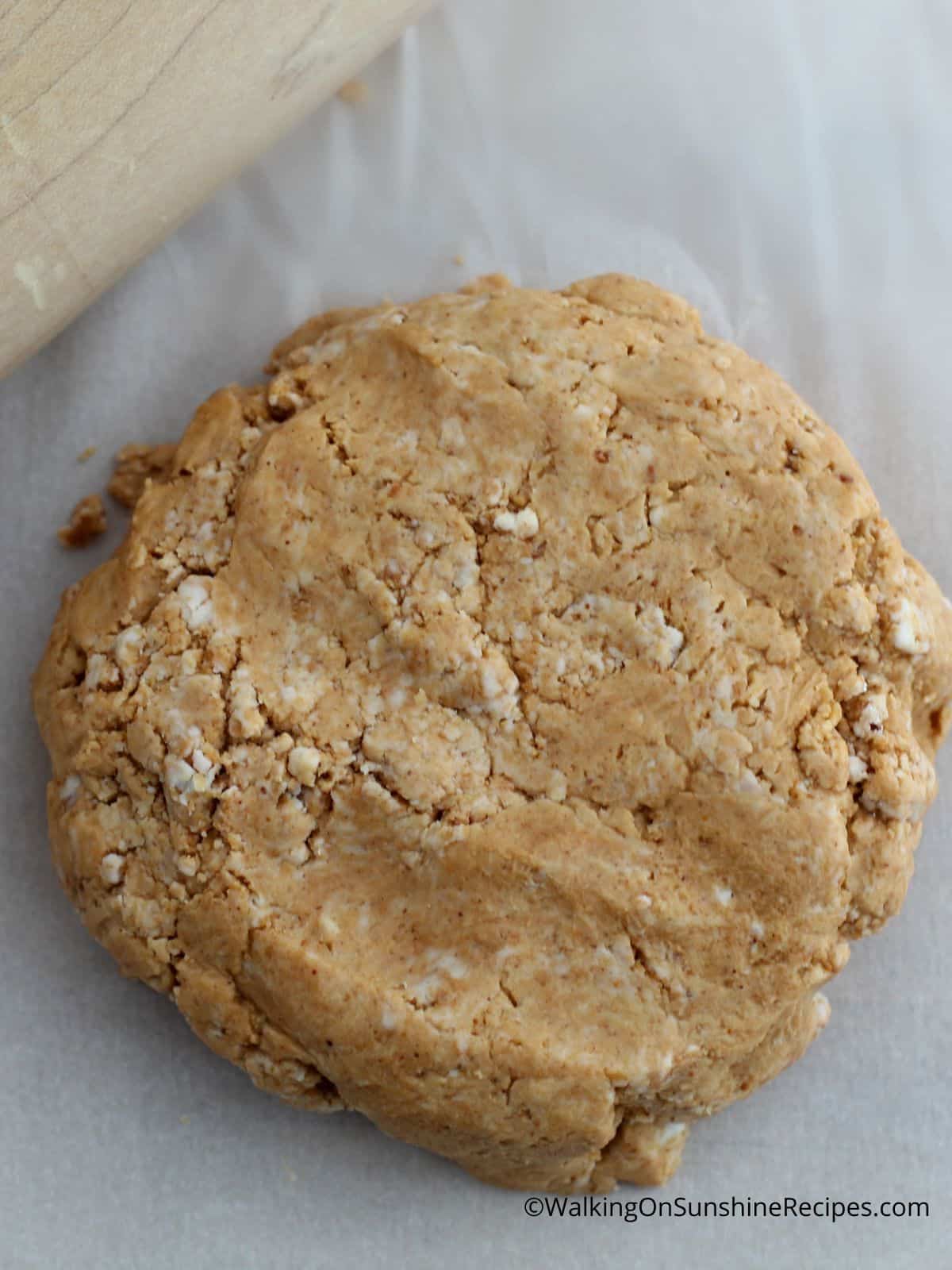 disc of peanut butter with powdered sugar dough.
