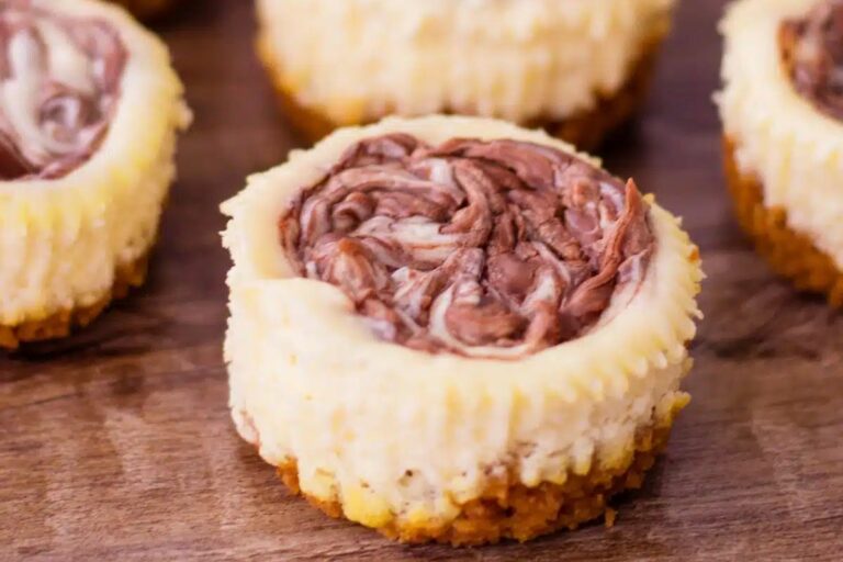 Mini cheesecakes with Nutella swirl.