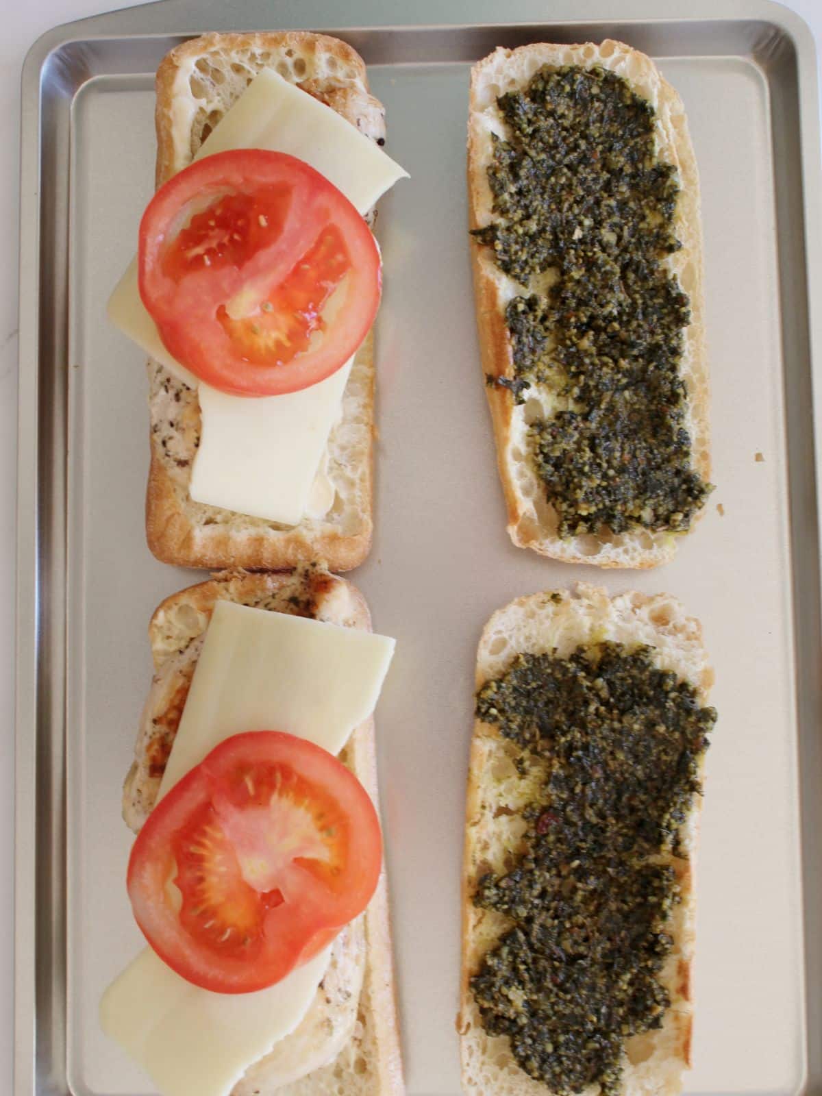 cheese and tomato added to the sandwich