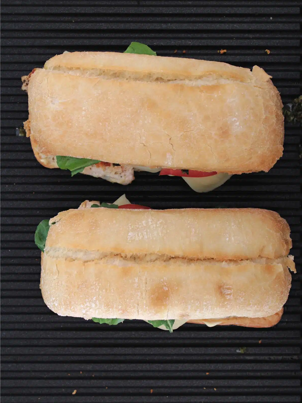 Tops of the bread placed on the sandwiches