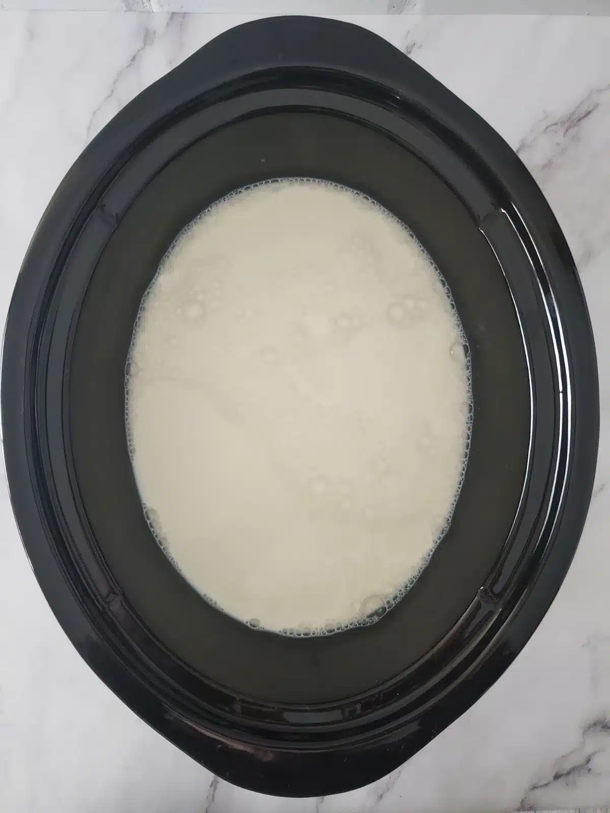 Milk in crock pot for homemade yogurt.