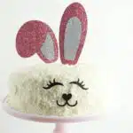 Vanilla cake with shredded coconut decorated for Easter.