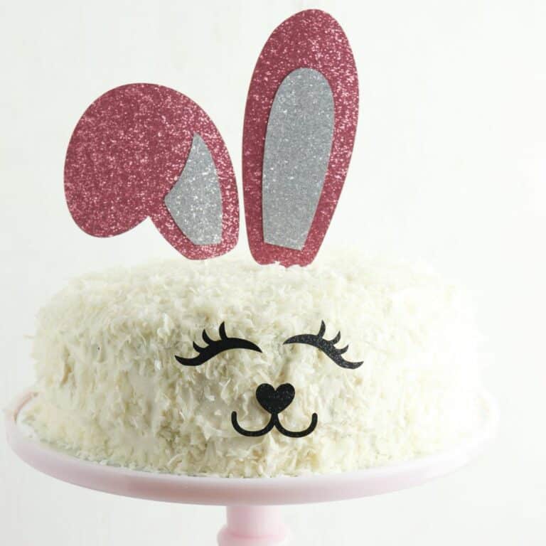 Vanilla cake with shredded coconut decorated for Easter.