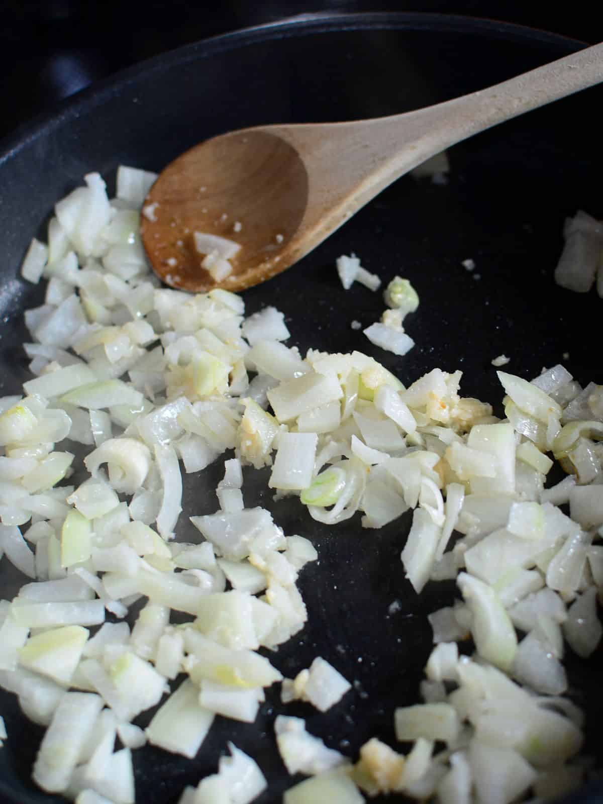 cook onion in frying pan,