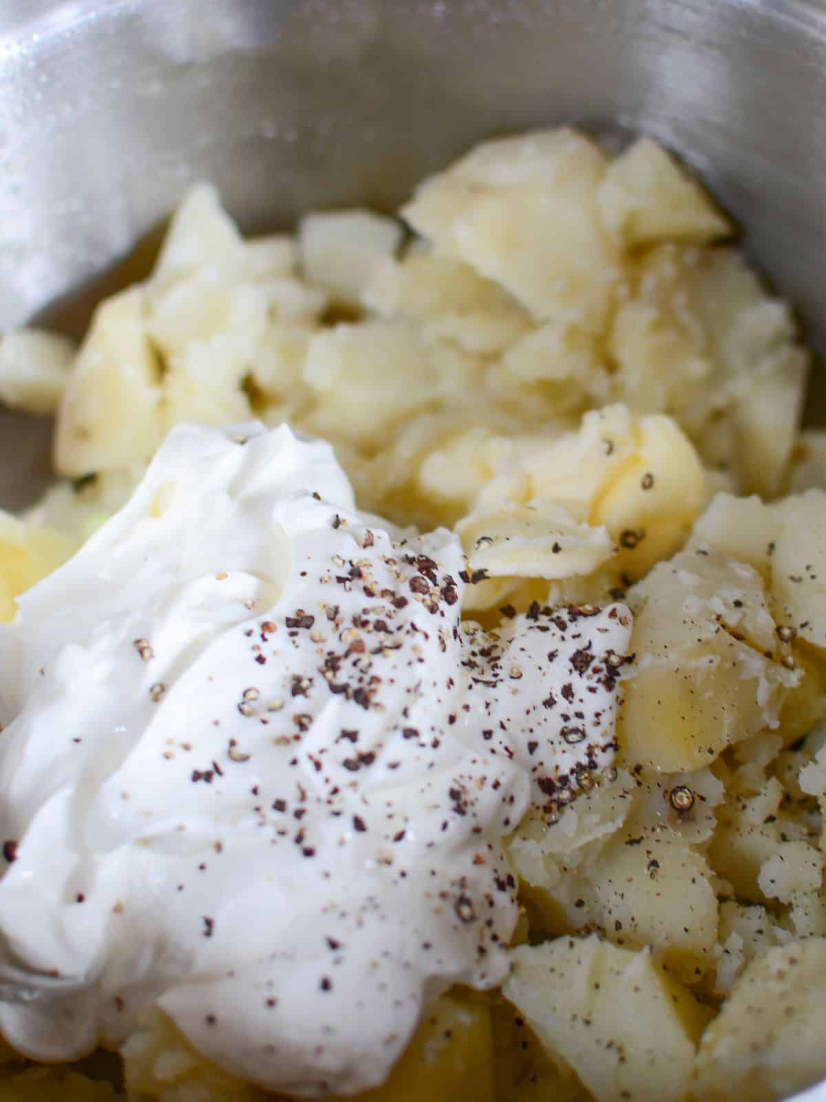 Potato cubes with sour cream, salt and pepper.