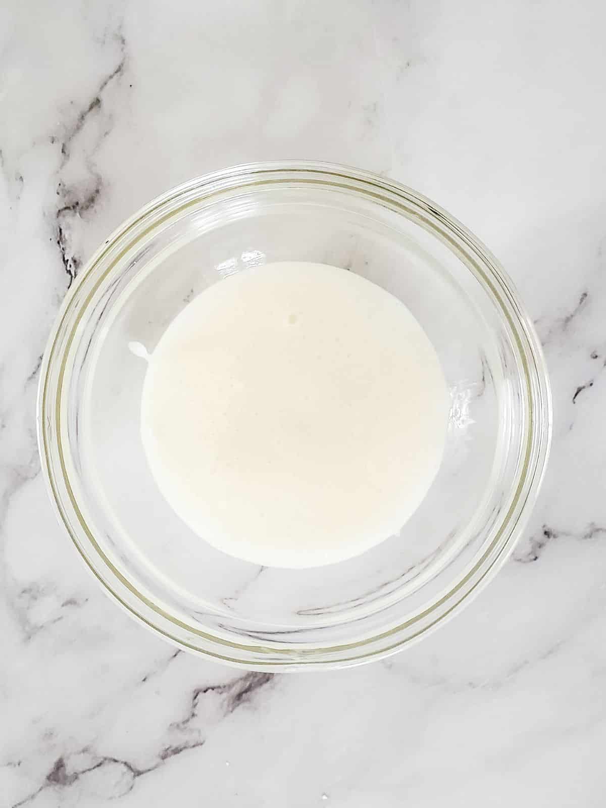 powdered sugar glaze in bowl.