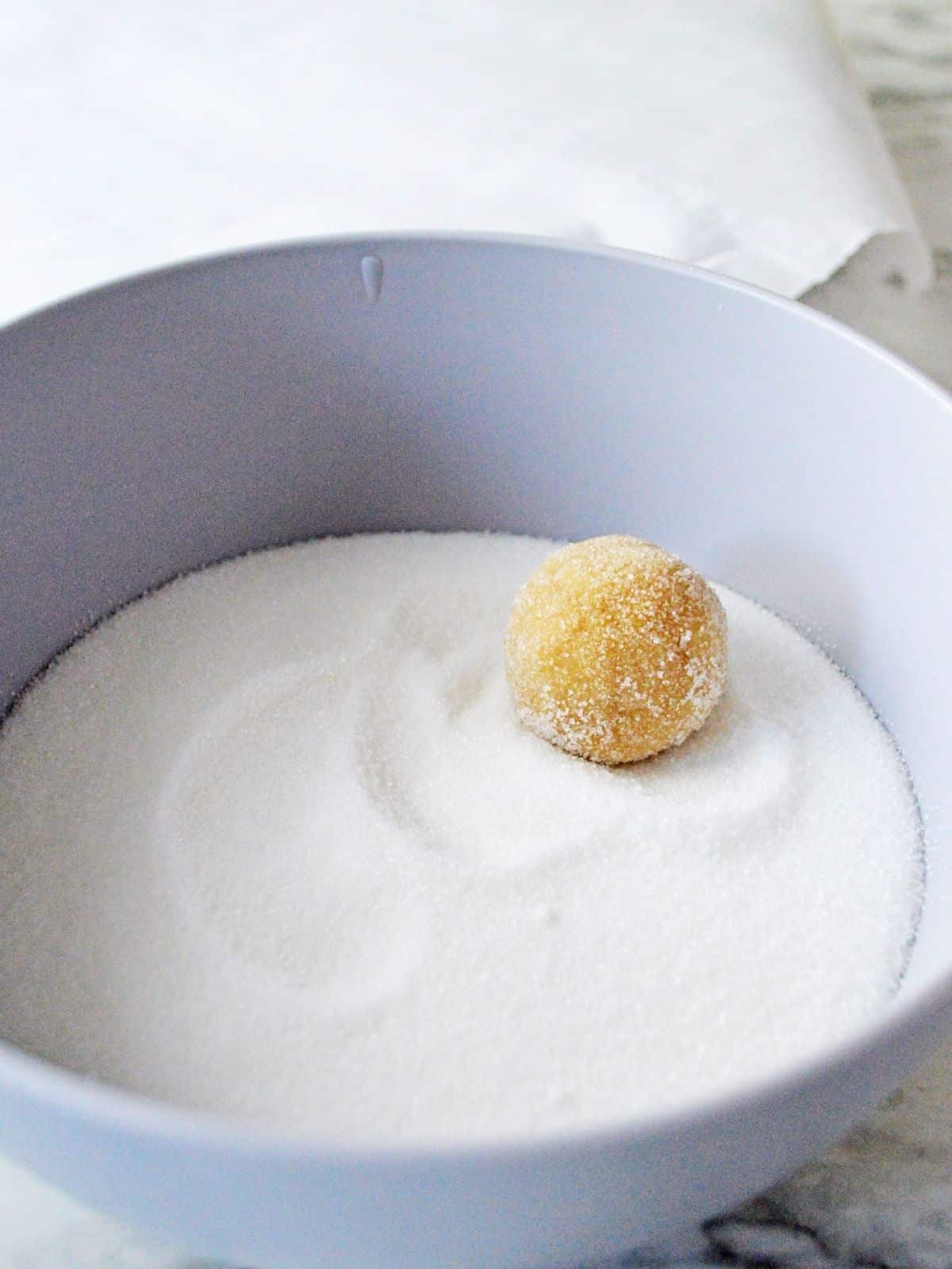 roll cookie ball in granulated sugar.