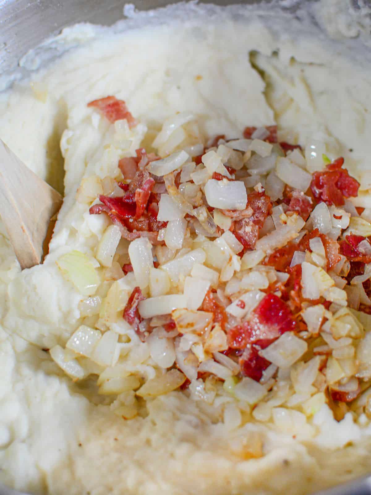 Add bacon and onions to mashed potato mixture.