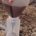 fill squeeze bottle with melted chocolate.