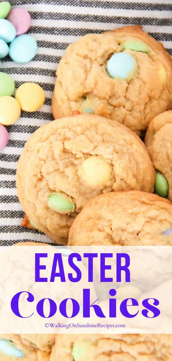 homemade cookies with pastel candy pieces on black and white dish towel.