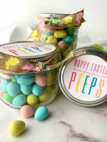 small mason jars filled with Easter treats.