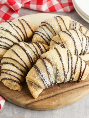 baked crescent rolls on cutting board.