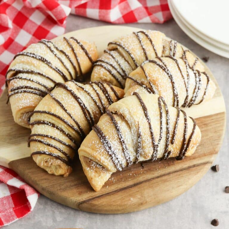 baked crescent rolls on cutting board.