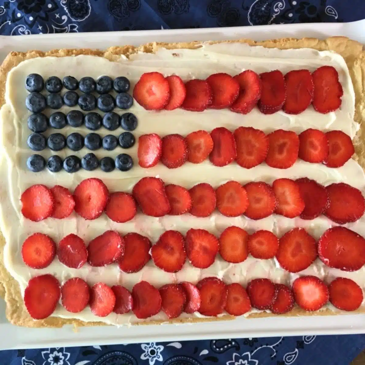 sugar cookie dough fruit pizza in the design of an American flag.